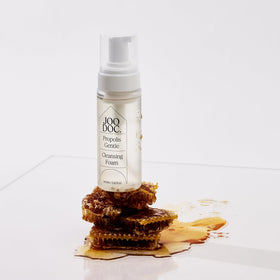 JOODOC bottle held in hand for size and scale to show the 160ml travel-friendly volume