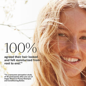Josie Maran product in hand applying lather to hair for visible foaming action