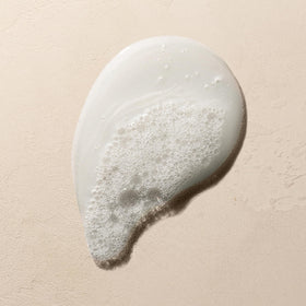 Josie Maran shampoo next to conditioning butter showing recommended pairing benefits