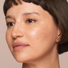 Jouer concealer texture swatch on skin showing creamy blendability benefit