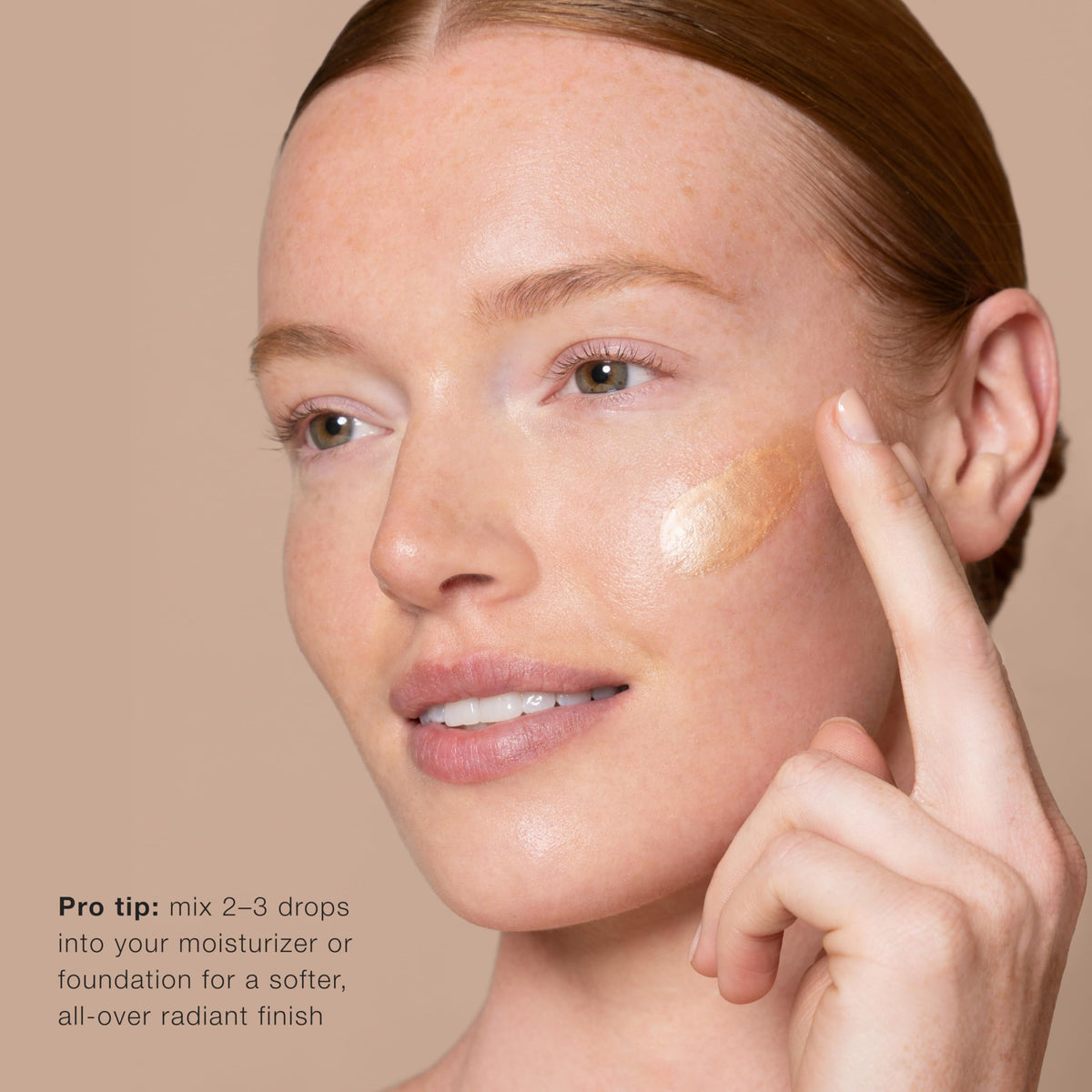 Jouer dropper releasing serum to show lightweight texture and buildable glow