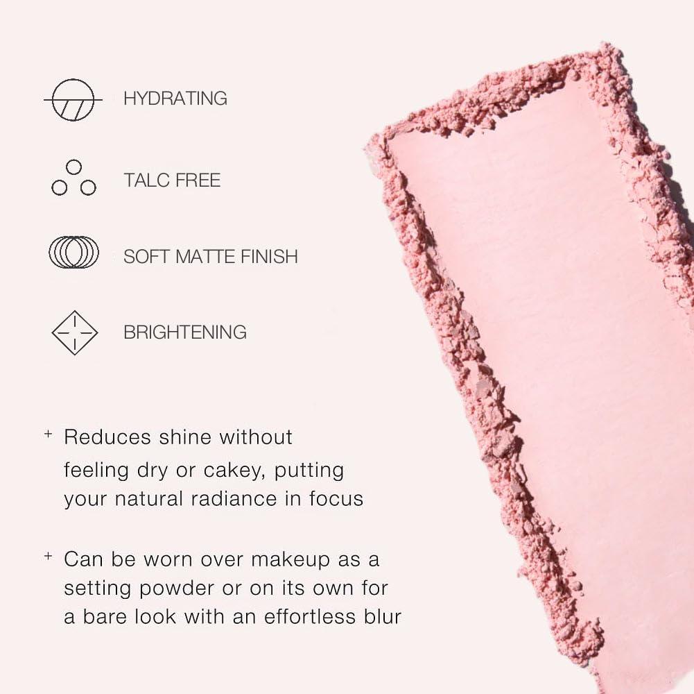 Jouer powder applied with brush under eye for visible brightening benefit
