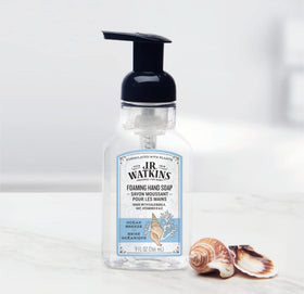 J.R. Watkins bottle beside sink showing scale, compact size for counters
