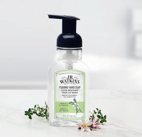 J.R. Watkins bottle staged on bathroom counter providing attractive, guest-ready hand care benefit
