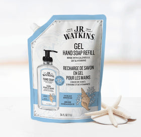 J.R. Watkins pouch pouring into pump bottle demonstrating easy refill use