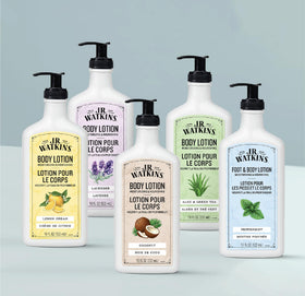 J.R. Watkins bottle next to hand showing 18 fl oz size scale