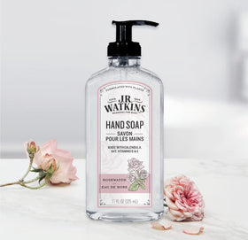 Person using J.R. Watkins rosewater gel at kitchen sink for clean, lightly scented hands