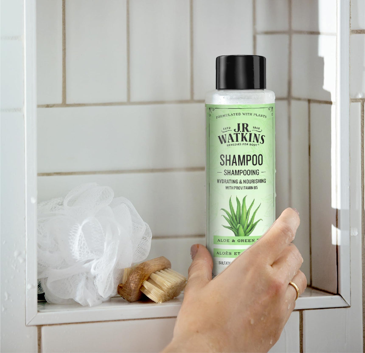 J.R. Watkins bottle in shower being applied for a refreshing daily cleanse