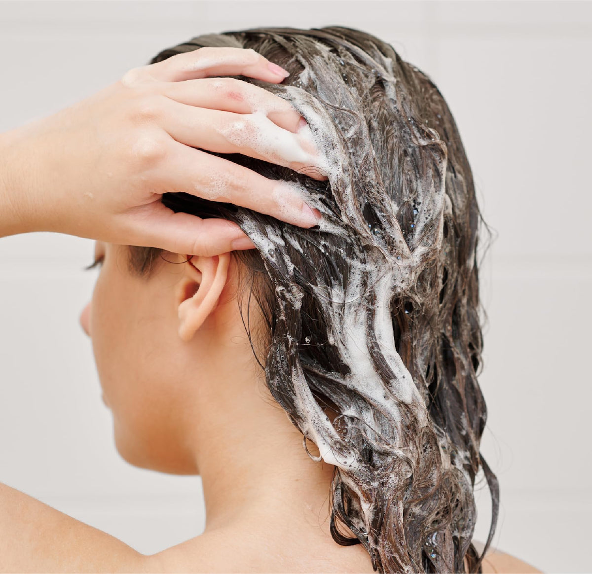 J.R. Watkins pump close-up revealing smooth shampoo texture and lather