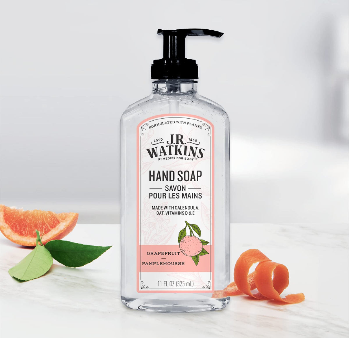 J.R. Watkins three bottles held in hand showing practical size and value benefit