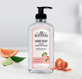 J.R. Watkins three bottles held in hand showing practical size and value benefit