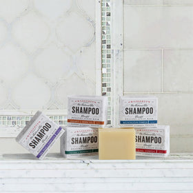 J·R·LIGGETT'S bar in hand illustrating compact size, perfect for travel