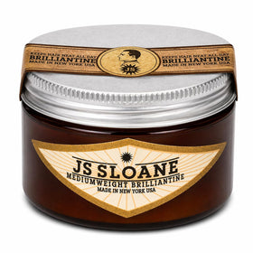 JS Sloane front packaging showing sleek tin and brand identity for polished styling
