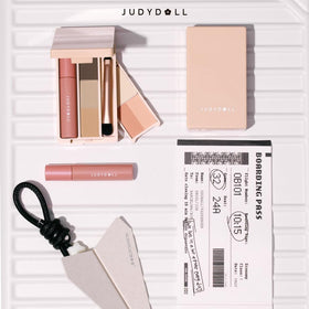 JUDYDOLL mini gloss swatches demonstrating glossy finish and layering versatility