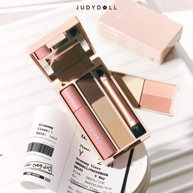 JUDYDOLL size comparison in hand illustrating compact portability for travel