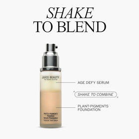 Juice Beauty bottle placed with roses and leaves highlighting botanical ingredients