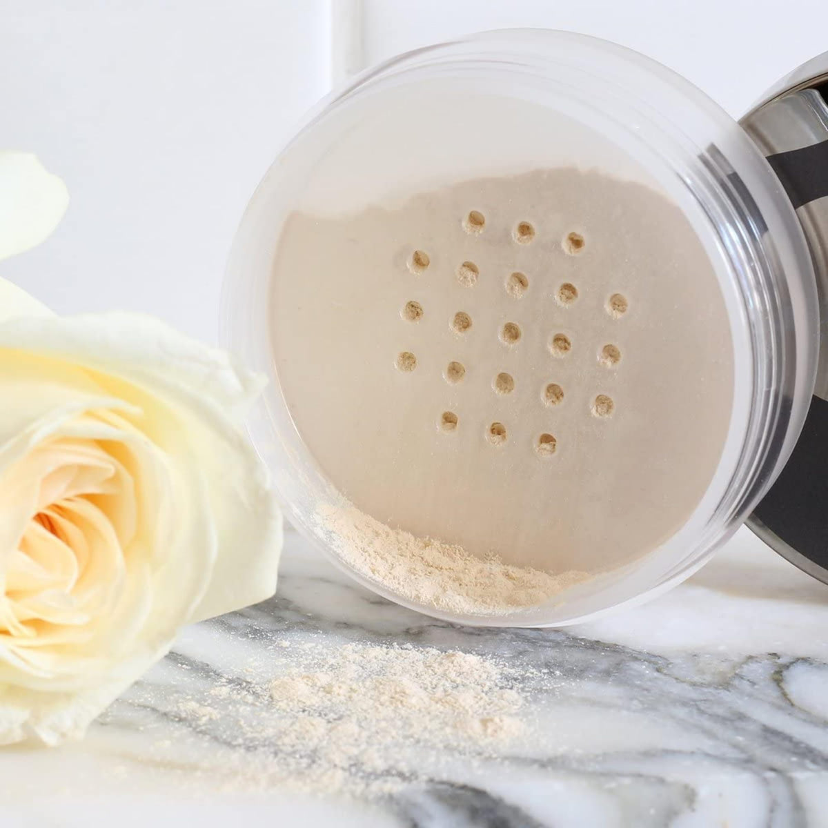 Juice Beauty in-use dusted over face from brush for matte, luminous look