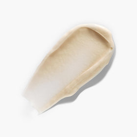 Juice Beauty primer texture close-up on fingertip, shows silky hydrating finish and glow