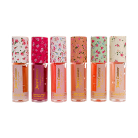 Juicy Couture tube beside pencil for size scale and travel-friendly convenience