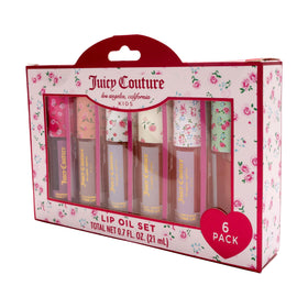 Juicy Couture tinted lip oil swipe on lips in use demonstrating glossy finish