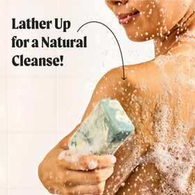 JUKEBOX foamy lather on a loofah demonstrating rich cleansing and mild suds
