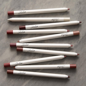 Julep lifestyle flatlay with liner and makeup items demonstrating everyday use
