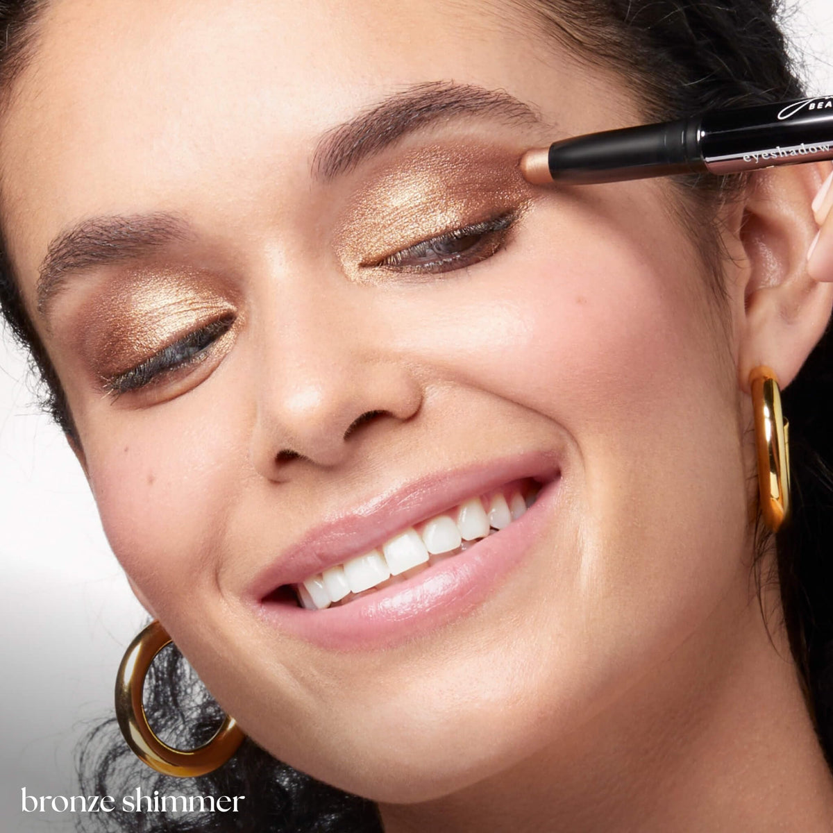 Julep bronze shimmer applied on eyelid showing crease-resistant wear