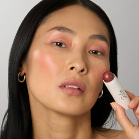 Julep fingertip blending on cheek showing quick no-brush benefit