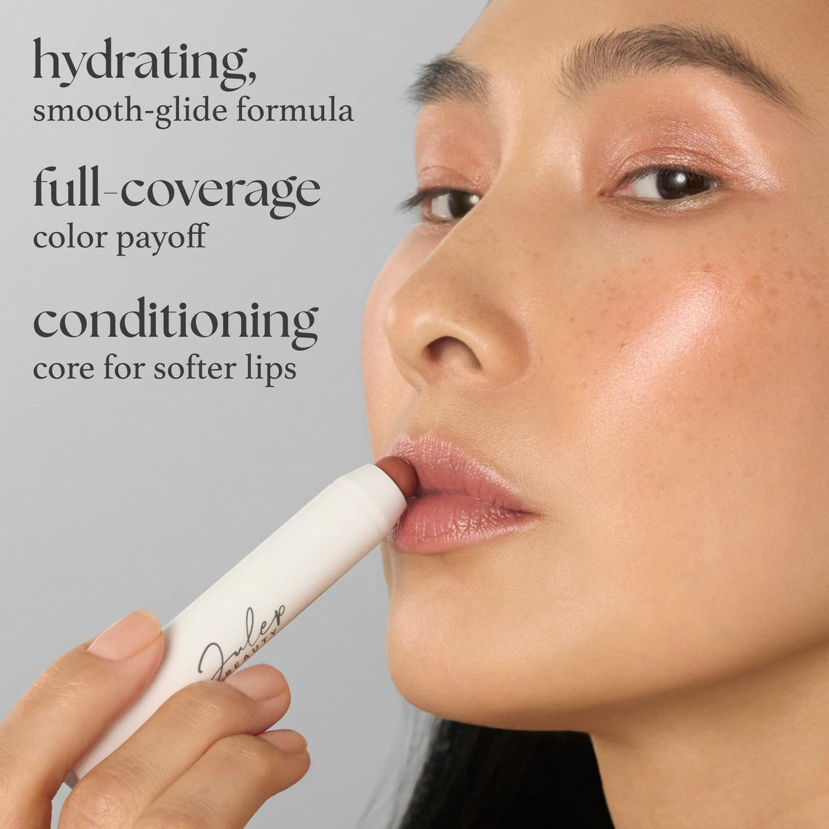 Application on model lips showing Julep plum tint and natural glossy finish benefit
