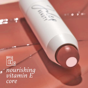 Julep tinted balm swiped on lips close-up showing buildable color and glossy finish benefit