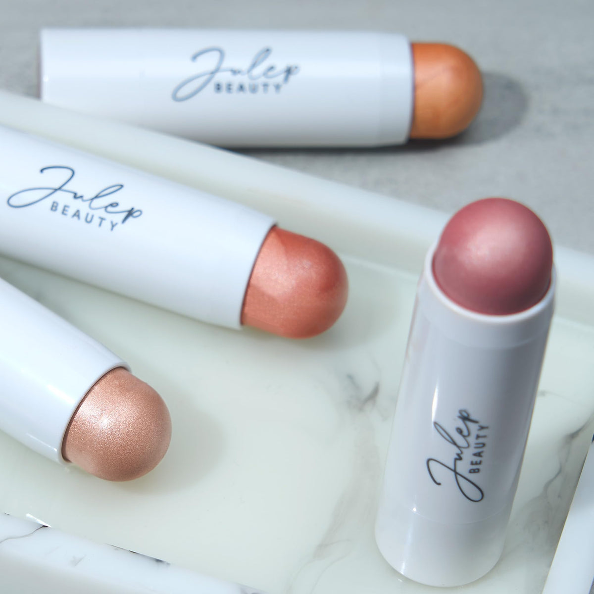 Julep trio inside a small bag, travel-and-touch-up convenience benefit