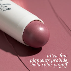 Julep swatch of muted mauve on forearm demonstrating buildable natural pigment
