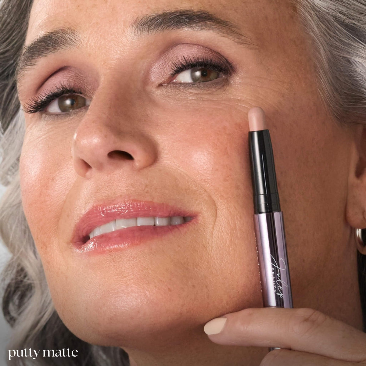 Julep stick being applied to eyelid for quick, brush-free makeup