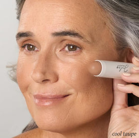 Julep stick held in hand to show scale and travel-friendly size