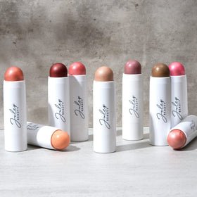 Julep held in hand for scale, compact stick size benefit