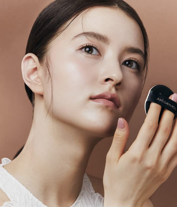 JUNG SAEM MOOL compact next to palm for size comparison and travel convenience