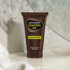Just for Men on bathroom shelf styled with grooming items conveying effortless maintenance benefit