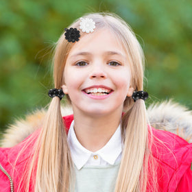 Jutom clips worn at a birthday party showing playful decorative appeal