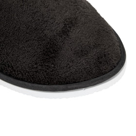 Juvale slippers placed in a hotel bedroom showcasing guest-ready hospitality
