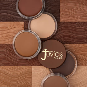 Juvia's Place bronzer next to coin for size comparison and portable convenience
