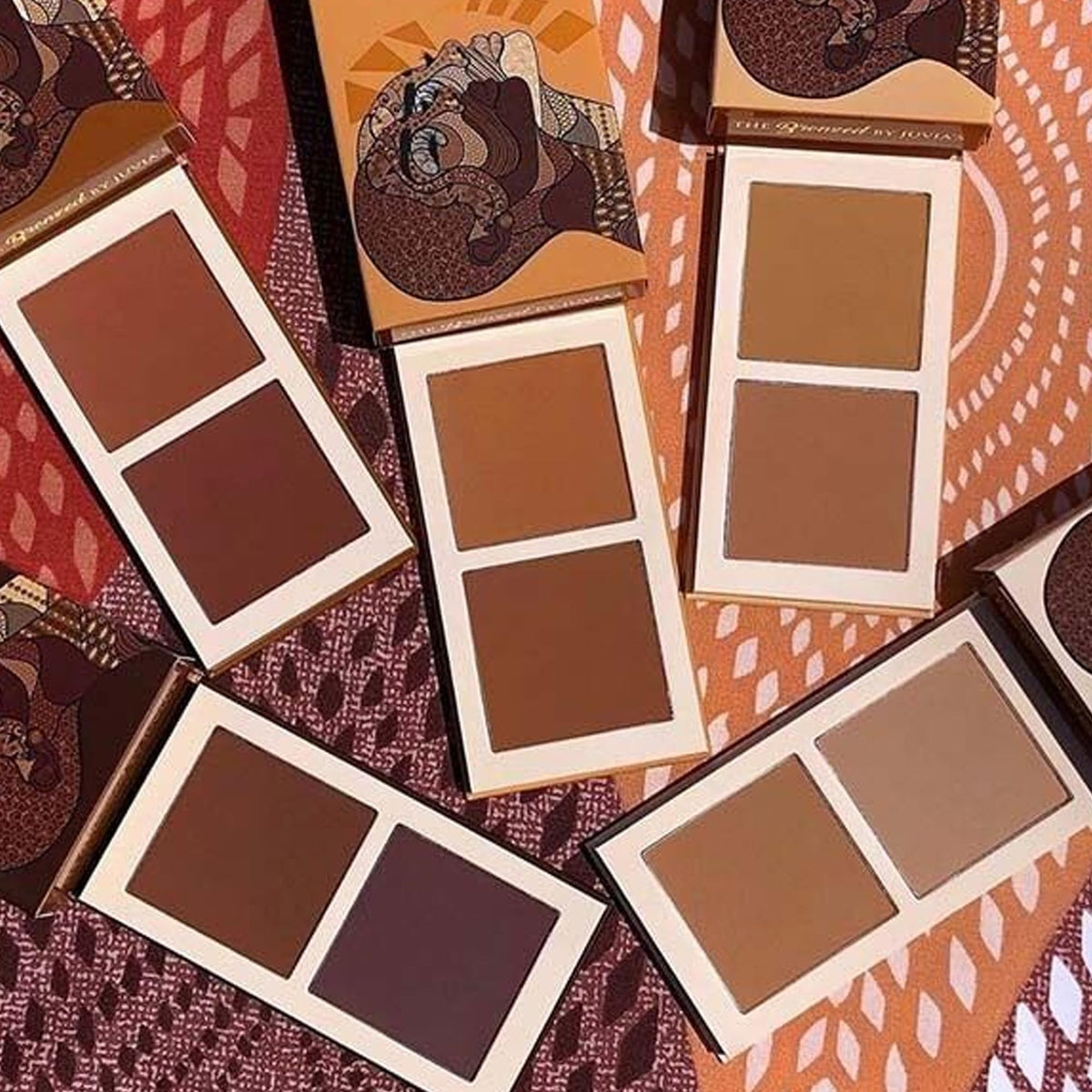 Juvia's Place bronzer in a makeup bag on vanity showing everyday lifestyle use