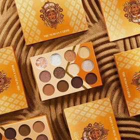 Juvia's Place lifestyle flatlay with palette and tools, ready-for-the-day makeup kit