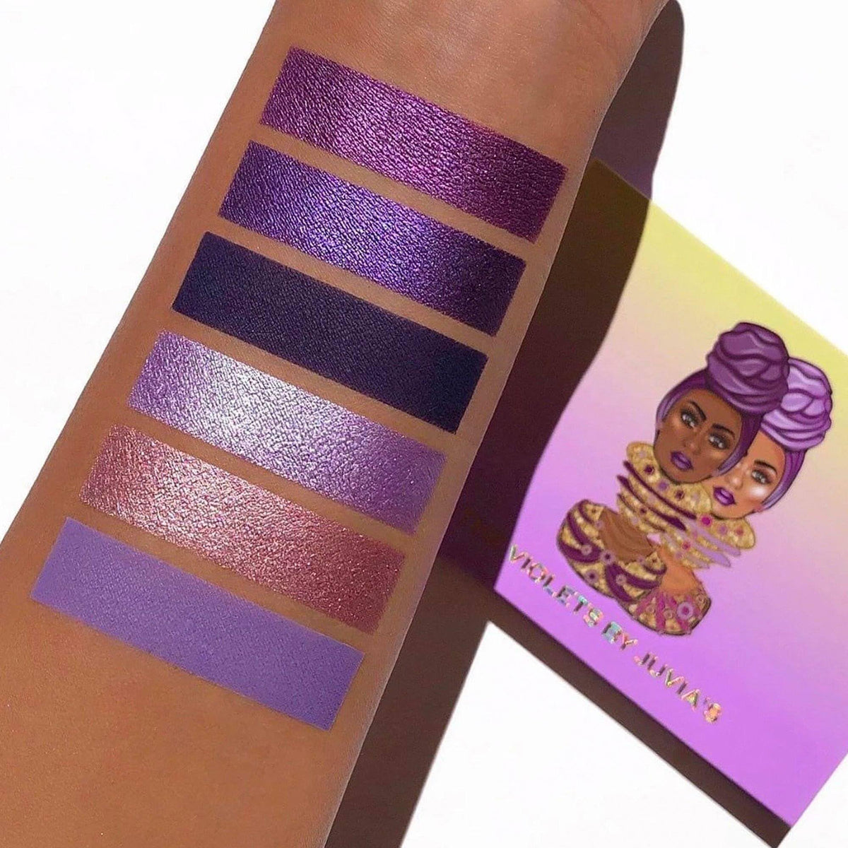 Juvia's Place palette held in hand for scale and travel-friendly convenience benefit