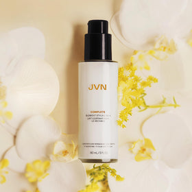 JVN travel tube beside credit card showing compact portable size benefit
