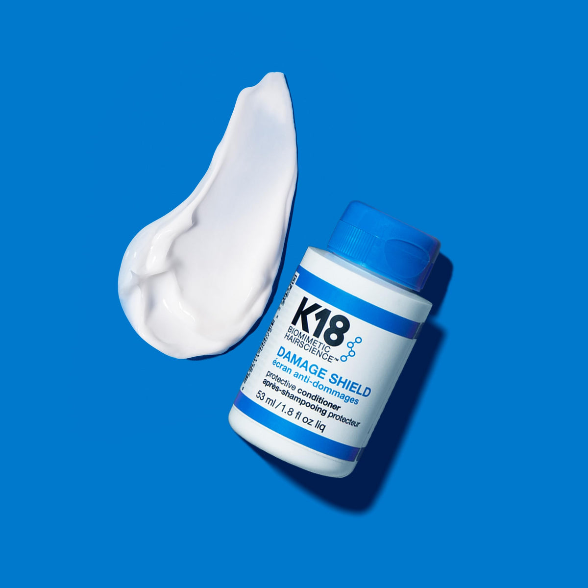 K18 conditioner creamy texture close-up demonstrating smooth slip and lightweight feel