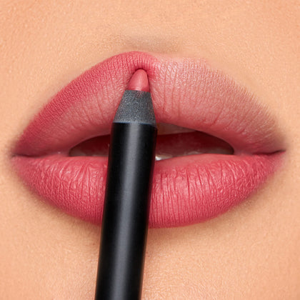 K7L front view of closed pink lip crayon showing compact design and portability