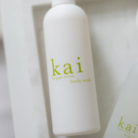 kai body wash in shower setting showing usage and fresh gardenia fragrance appeal