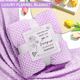 Kalokey lavender bath bomb and candle staged for calming at-home spa moment