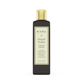Kama Ayurveda oil drops on hands illustrating lightweight texture and nourishment