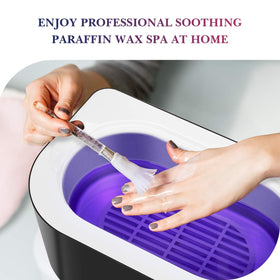 karite hands dipping into paraffin bath showing soothing treatment